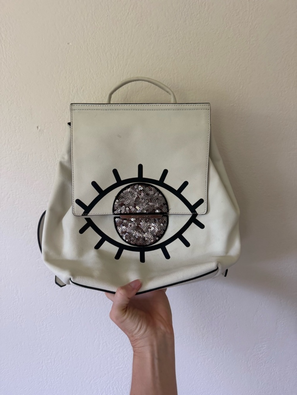 Kendall & Kylie White Backpack with Black Eye Graphic and Sequin Accent